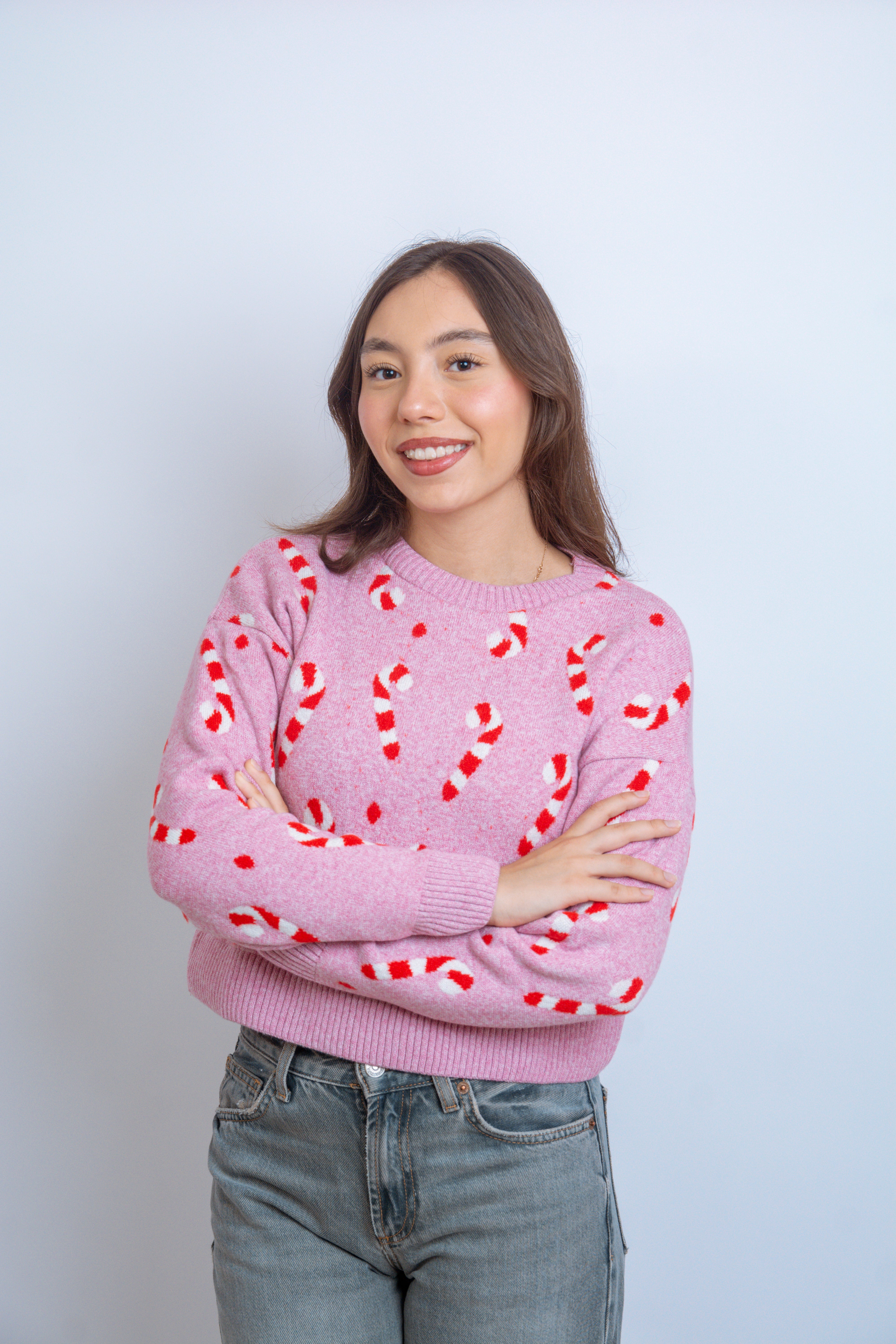 Ugly sweater navidad bastones rosa