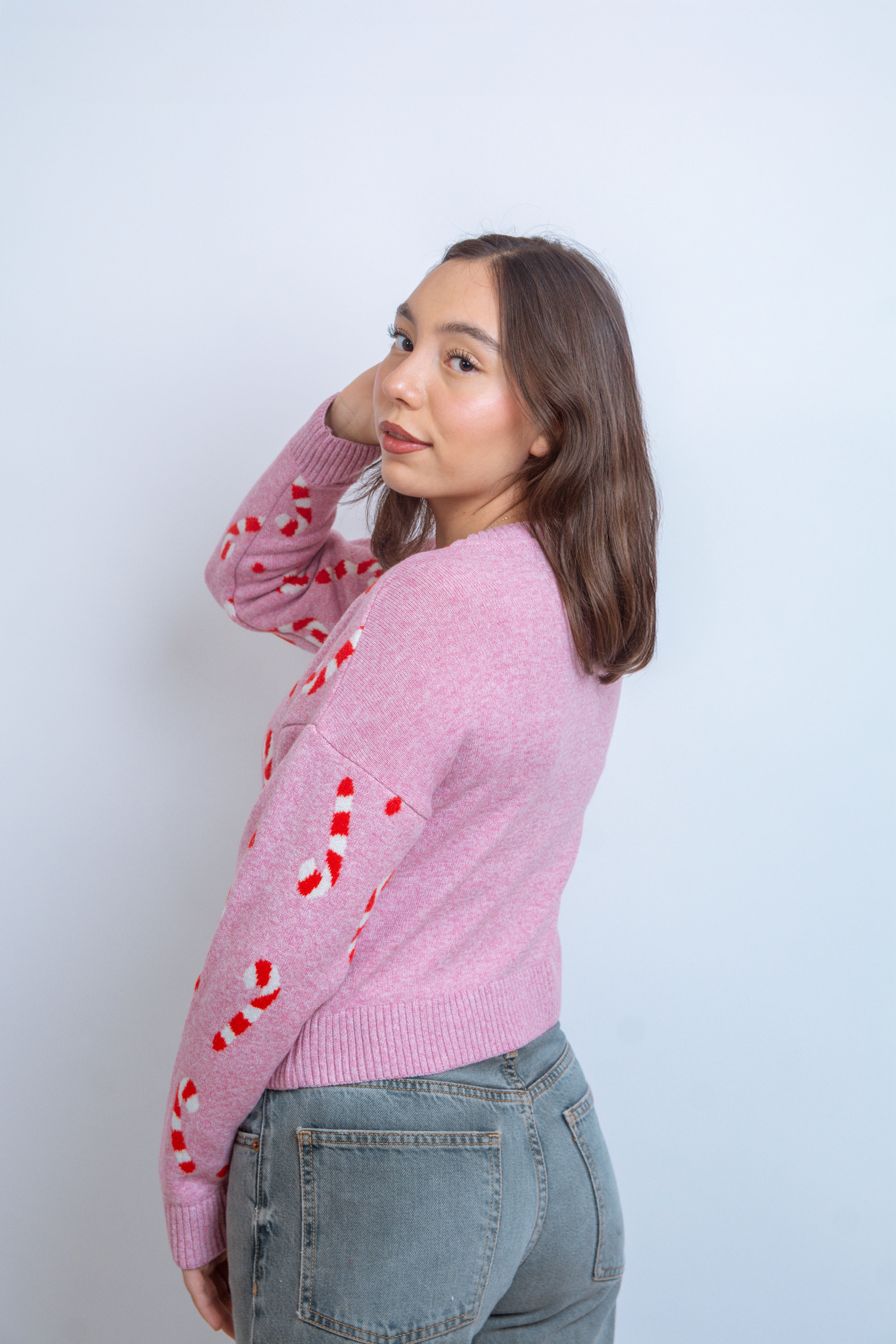 Ugly sweater navidad bastones rosa